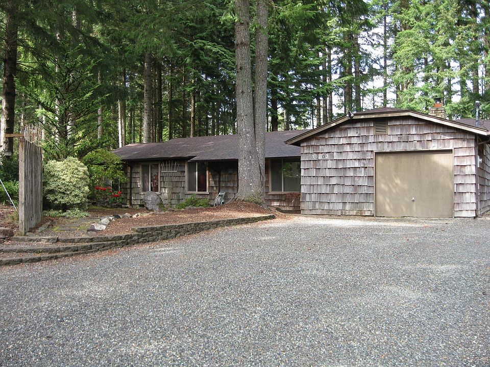 Rustic wood siding, composition roof and over 1,800 square feet of living spac