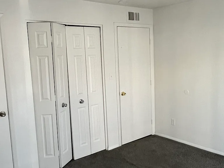 Bedroom 3 with two closet spaces