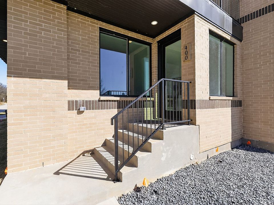 Entrance to property with brick siding