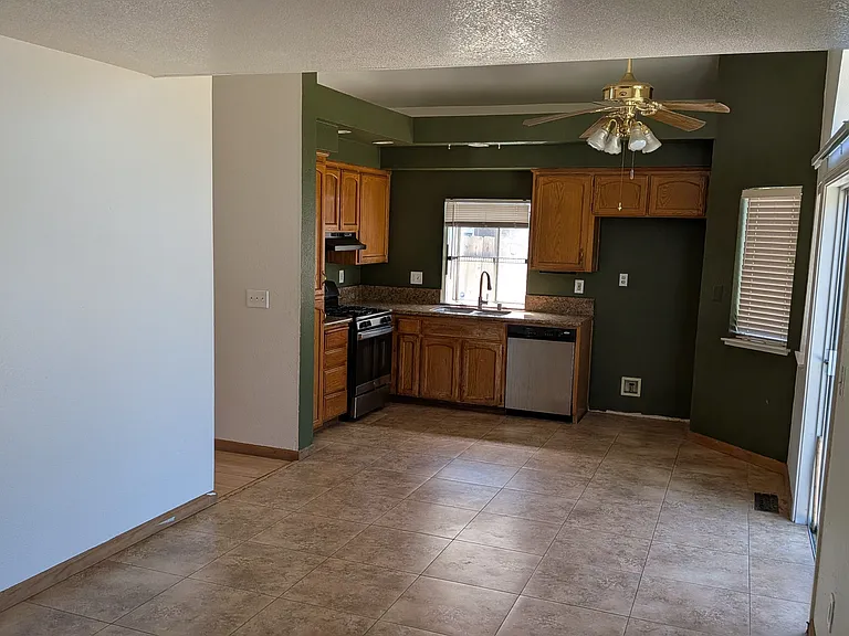Kitchen and Family room (On the right is the door that opens to backyard)