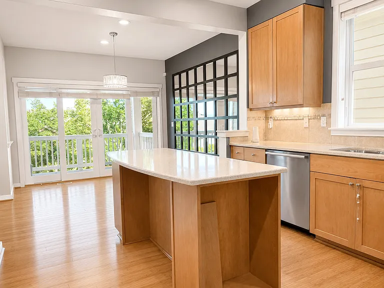 Well-maintained kitchen with Silestone countertops, stainless steel appliances, and a gas cooking range