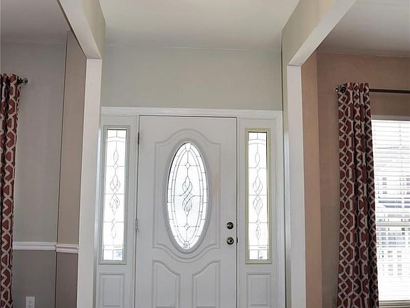 You are welcomed by this elegant leaded glass front door and sidelights.
