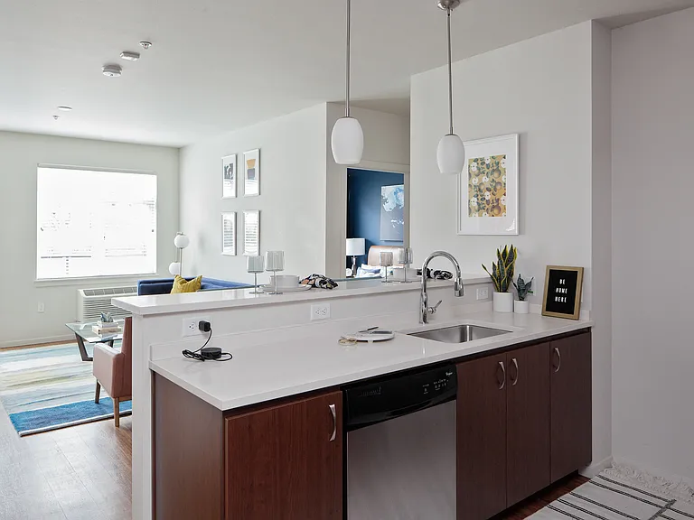 Grant Park Village kitchen island shot with living room in background
