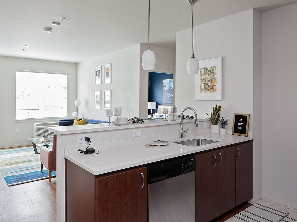Grant Park Village kitchen island shot with living room in background