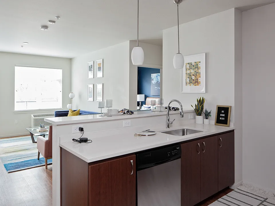 Grant Park Village kitchen island shot with living room in background