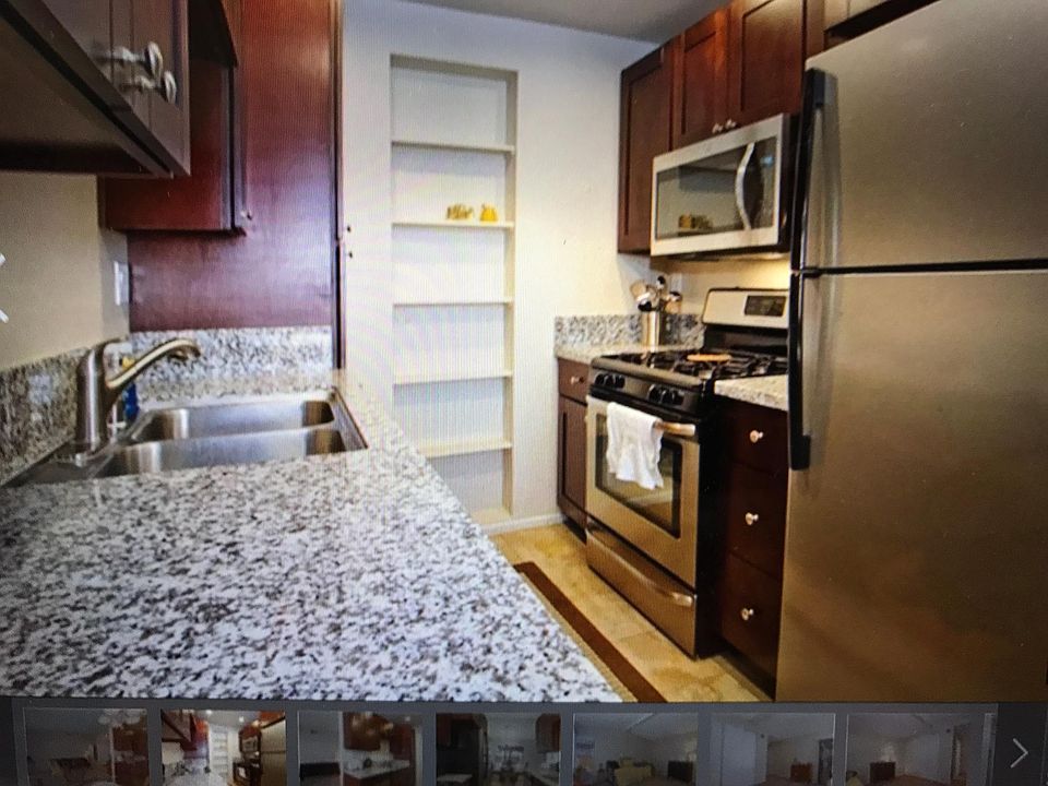 Renovated kitchen with refrigerator