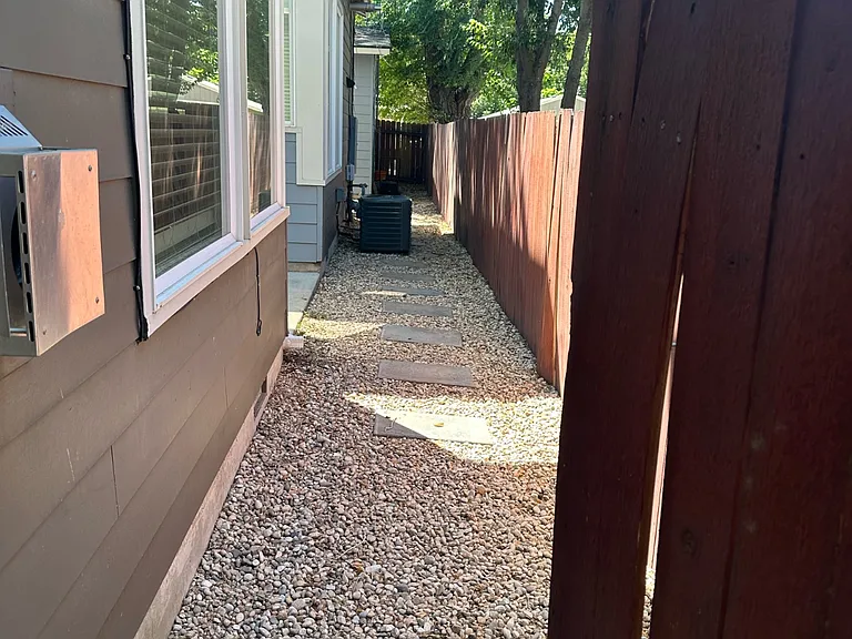 side of the house, fully fenced yard