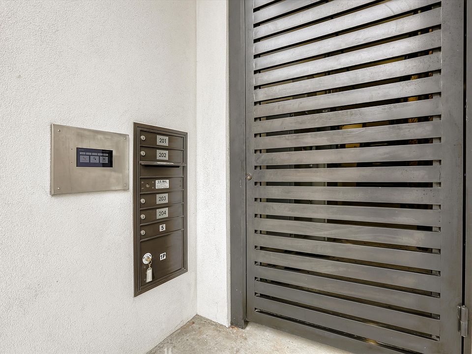 The property is secure, with gated entry for the pedestrian walkway and a private, gated parking garage for residents.