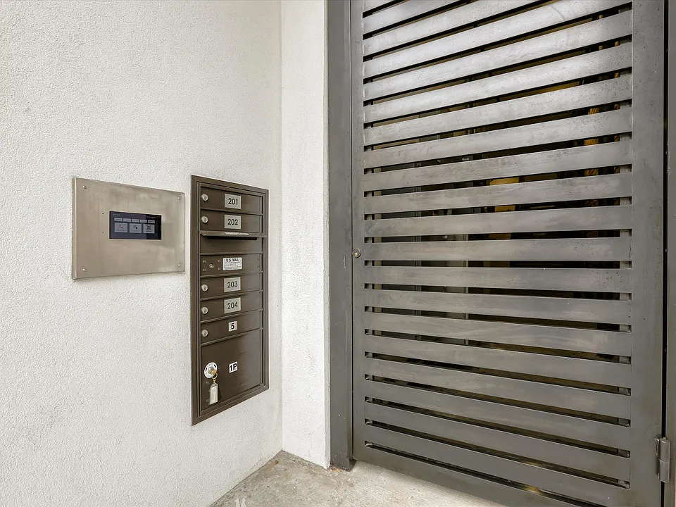 The property is secure, with gated entry for the pedestrian walkway and a private, gated parking garage for residents.