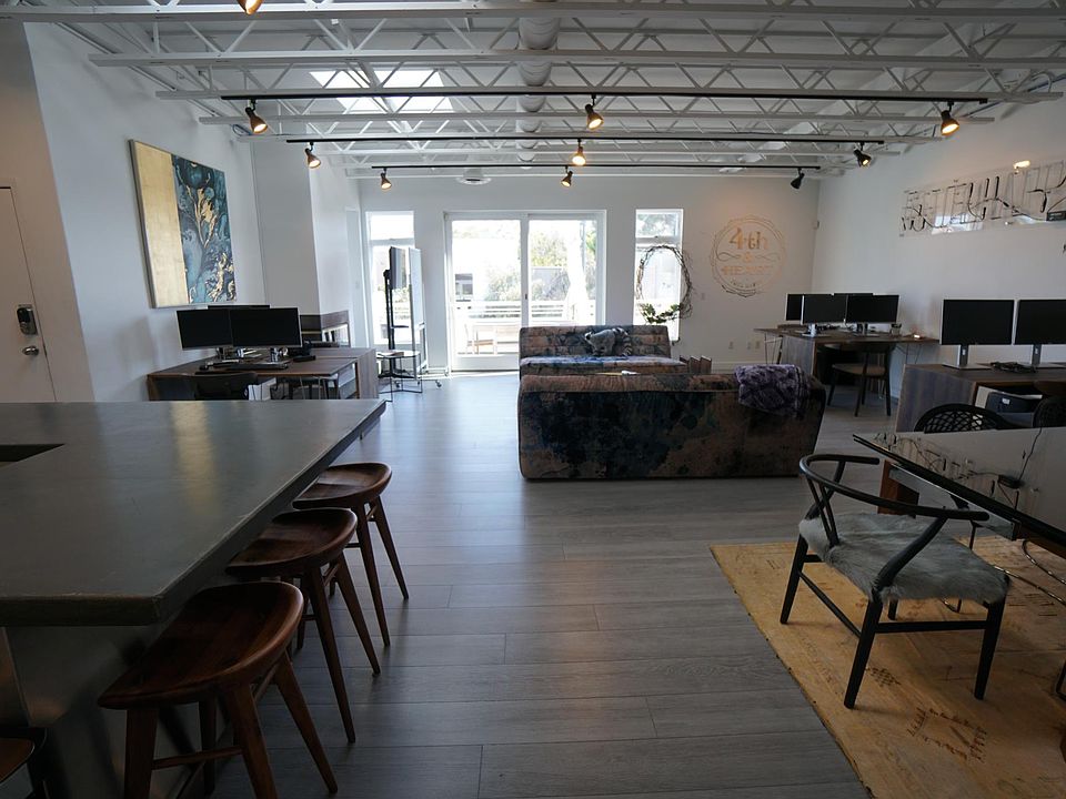 Exposed high ceilings and open kitchen