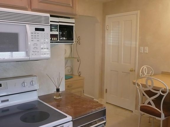 Kitchen left view toward garage door