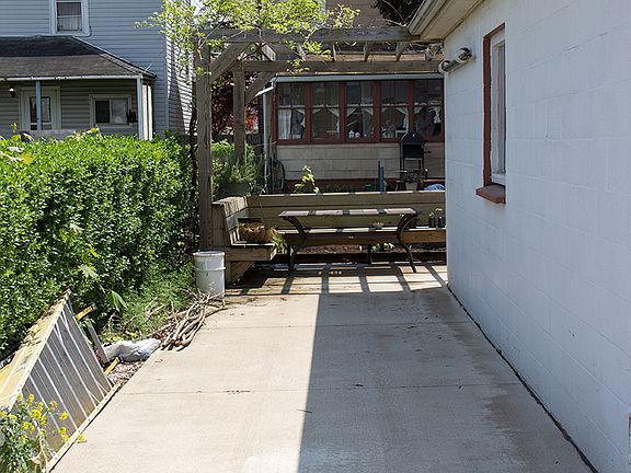 Concrete pad next to garage