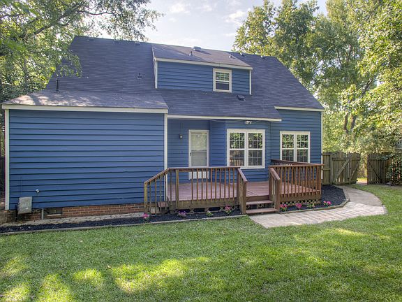 Back of house with deck