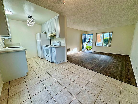 View from dining room into kitchen and living room