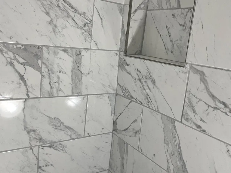 Shampoo and conditioner shelf built in