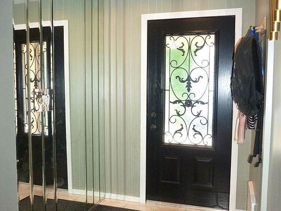 MIRROR & TILED ENTRANCE LEADS TO...