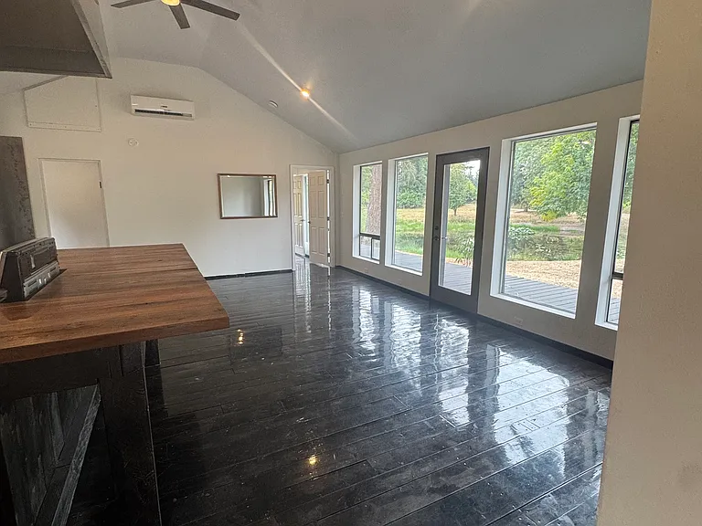 Large Wraparound Windows in the Living Room & Kitchen