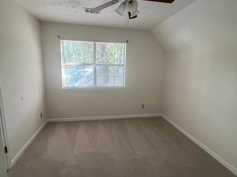Third bedroom with ceiling fan