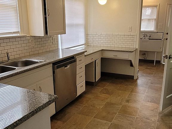 Kitchen with view to laundry room and back door.