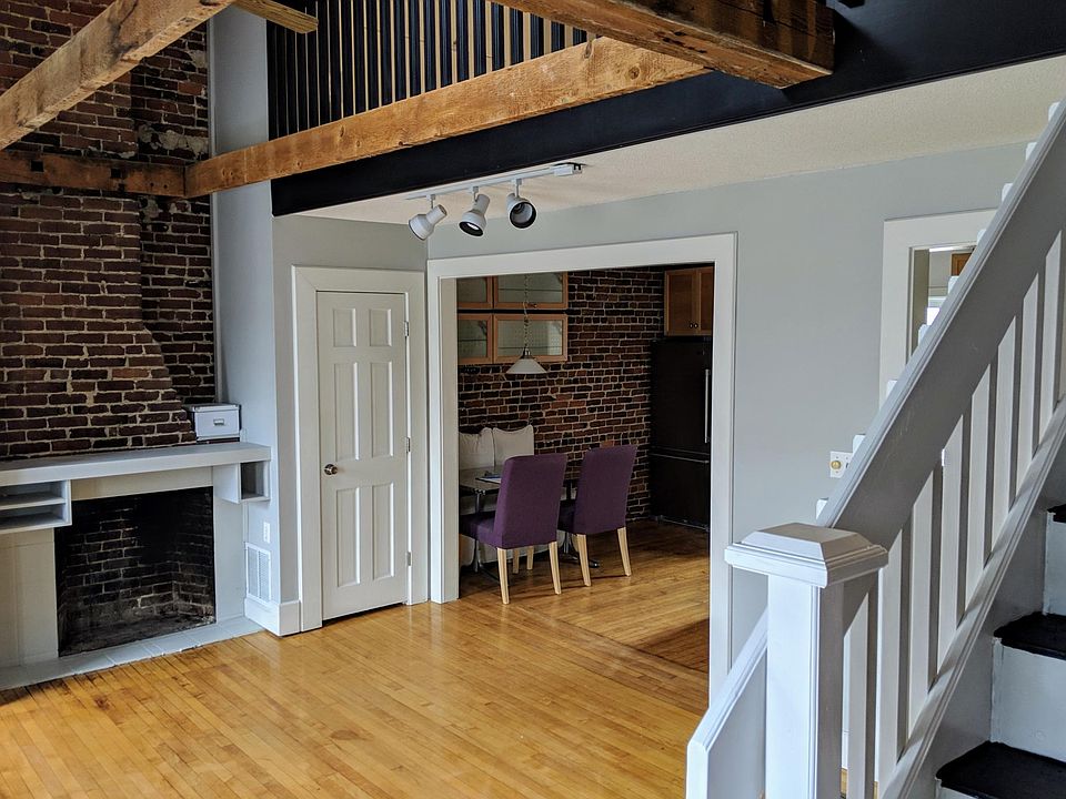 Living room, stairs to loft, looking to kitchen