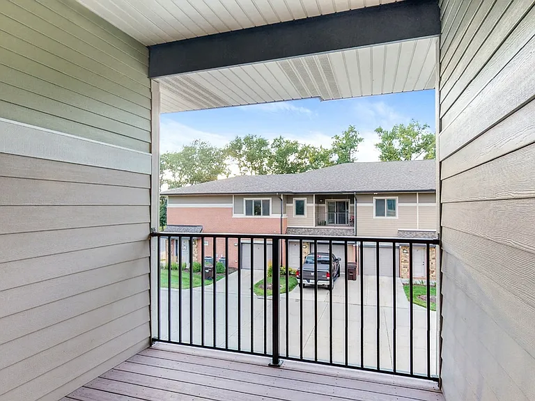 Step outside and take in the fresh air from your own private balcony, offering a quiet retreat just beyond your door.