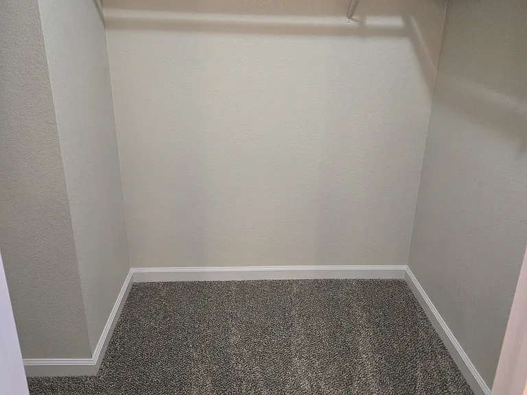 Oversized walk-in closet provides exceptional storage and organization.