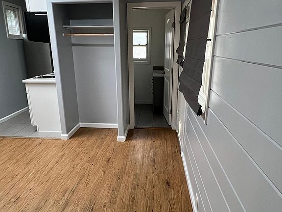 Good sized closet with curtain not included in photo.