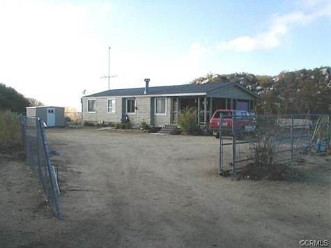 ENTRANCE INTO THE FENCED YARD AREA