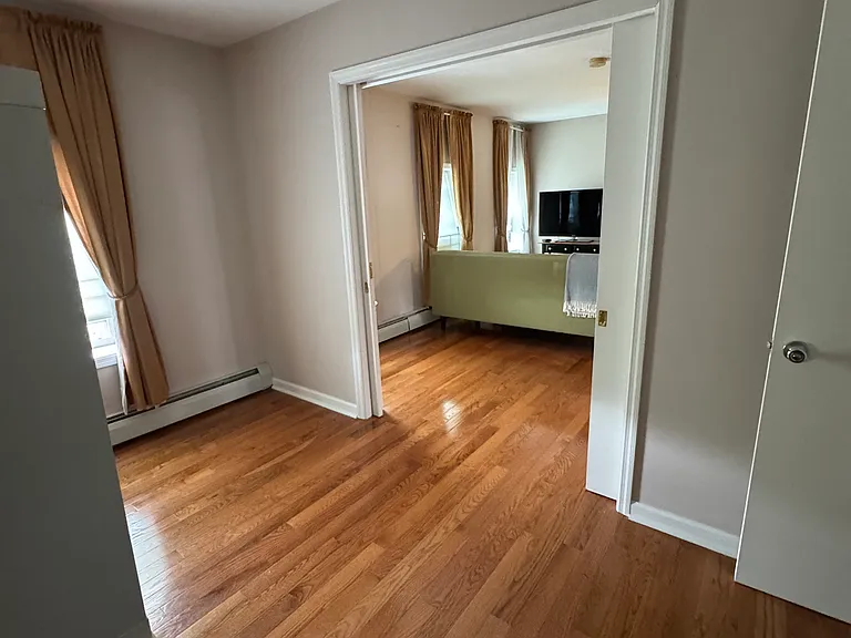 Room 2 with closet, dimmable lighting and pocket doors.