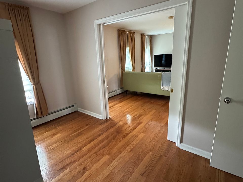 Room 2 with closet, dimmable lighting and pocket doors.