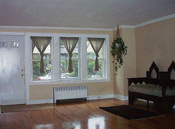 Living Room with Lots of light and Polished Wood Floors in Great Condition.