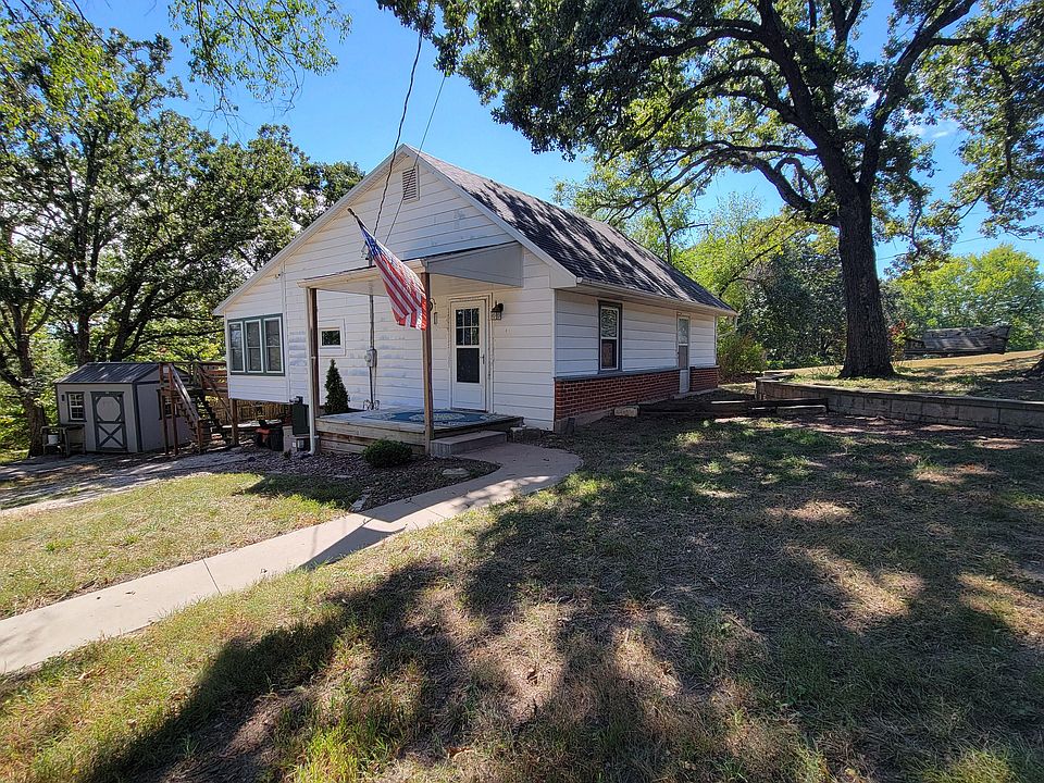 Front porch, shed at left.