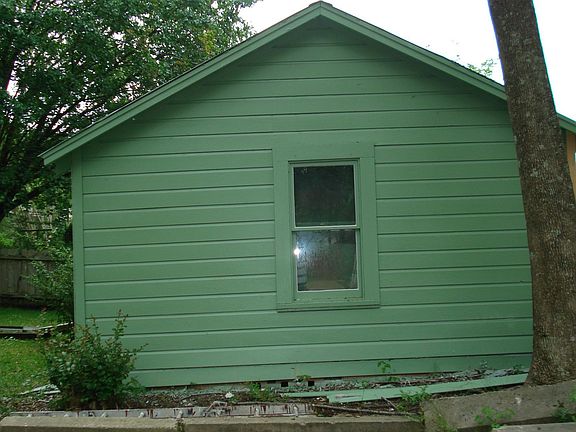 outside storage building behind house