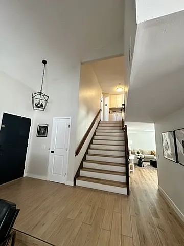 View to the front door and stairs