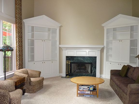 Two story den with dbl 12ft bookcases for your audio/visual components