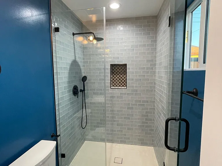 Bathroom, beautiful tile floor and rainfall shower head.