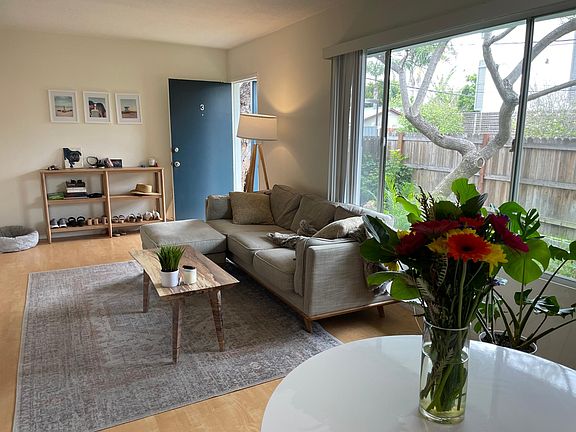 Living room with wood flooring and picture window
