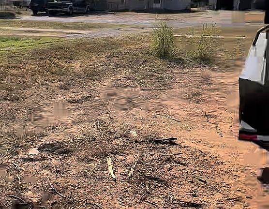 Facing SW, city water line