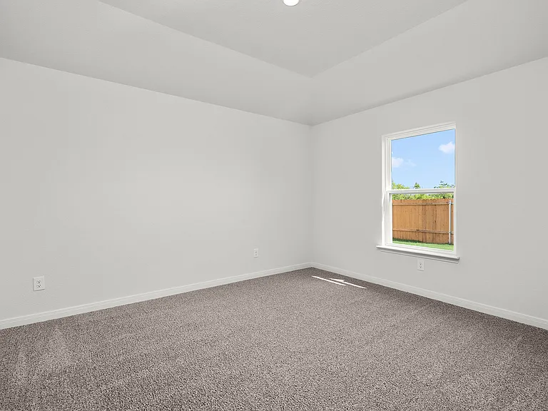 The master bedroom has plenty of space for large furniture.