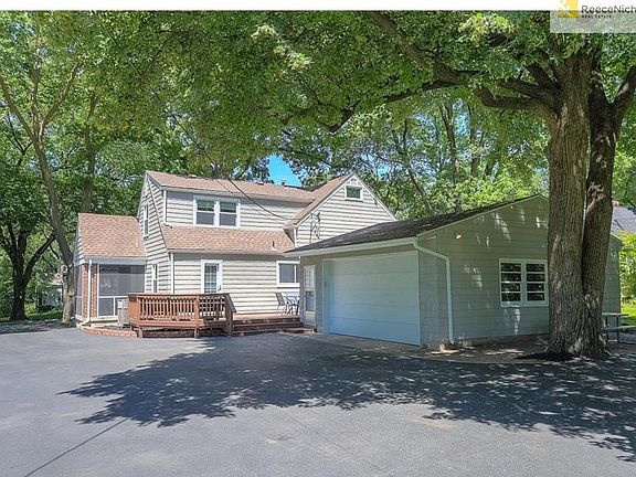 Rare attached two car garage plus extra driveway space, deck and patio!