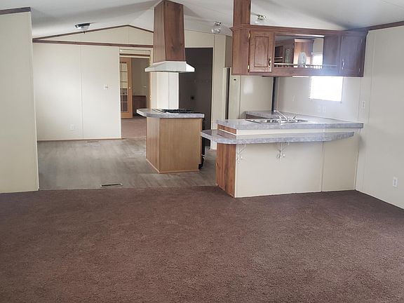 Standing in entry looking at living room and kitchen