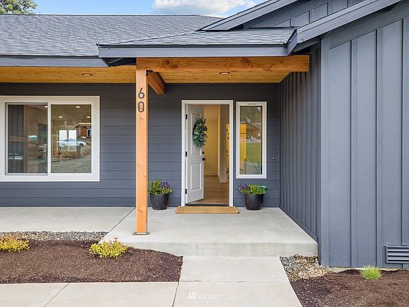 Clean crisp architectural lines are forefront as you approach and enter 60 Kingston Ct.