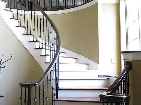 Dramatic spiral staircase with picture window. South facing so lots of natural light without all the