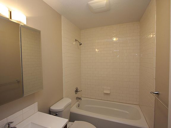 Bathroom with deep soaking tub and tile surround