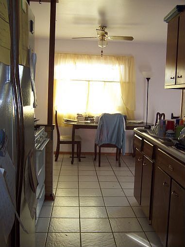 Galley kitchen and dining area
