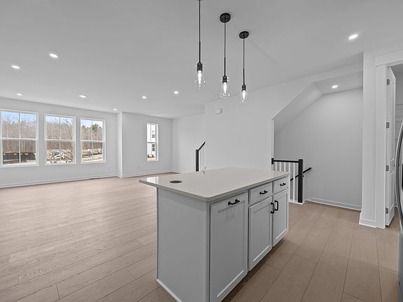 open floor plan living area, with walk in pantry