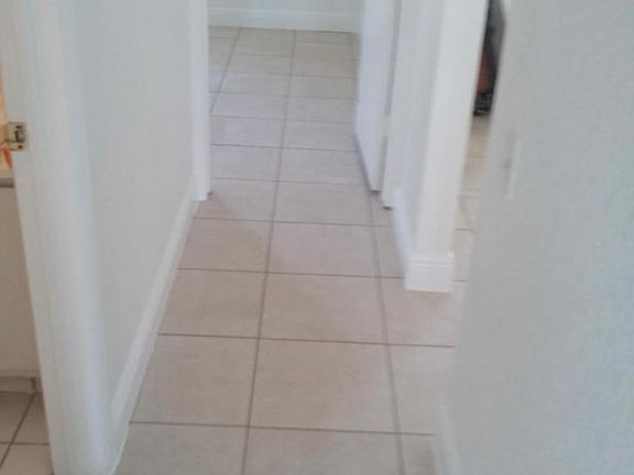 Hallway with each bedroom at each end and full bathroom in the middle