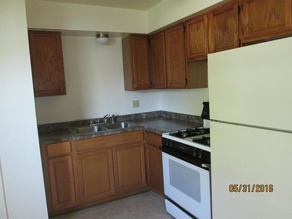 kitchen view of sink, stove & refrigerator