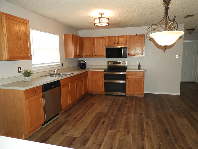 Kitchen with brand new appliances.