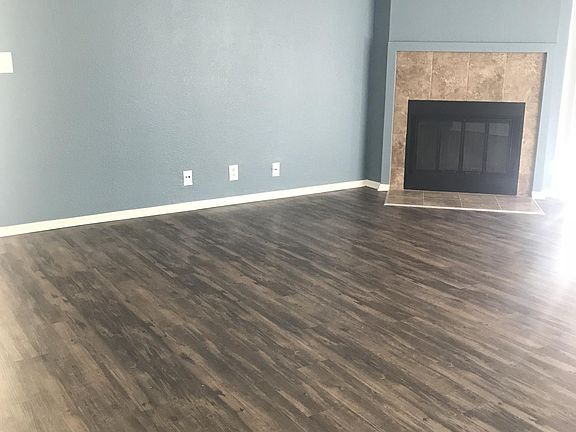 Living Room with Wood Burning Fireplace